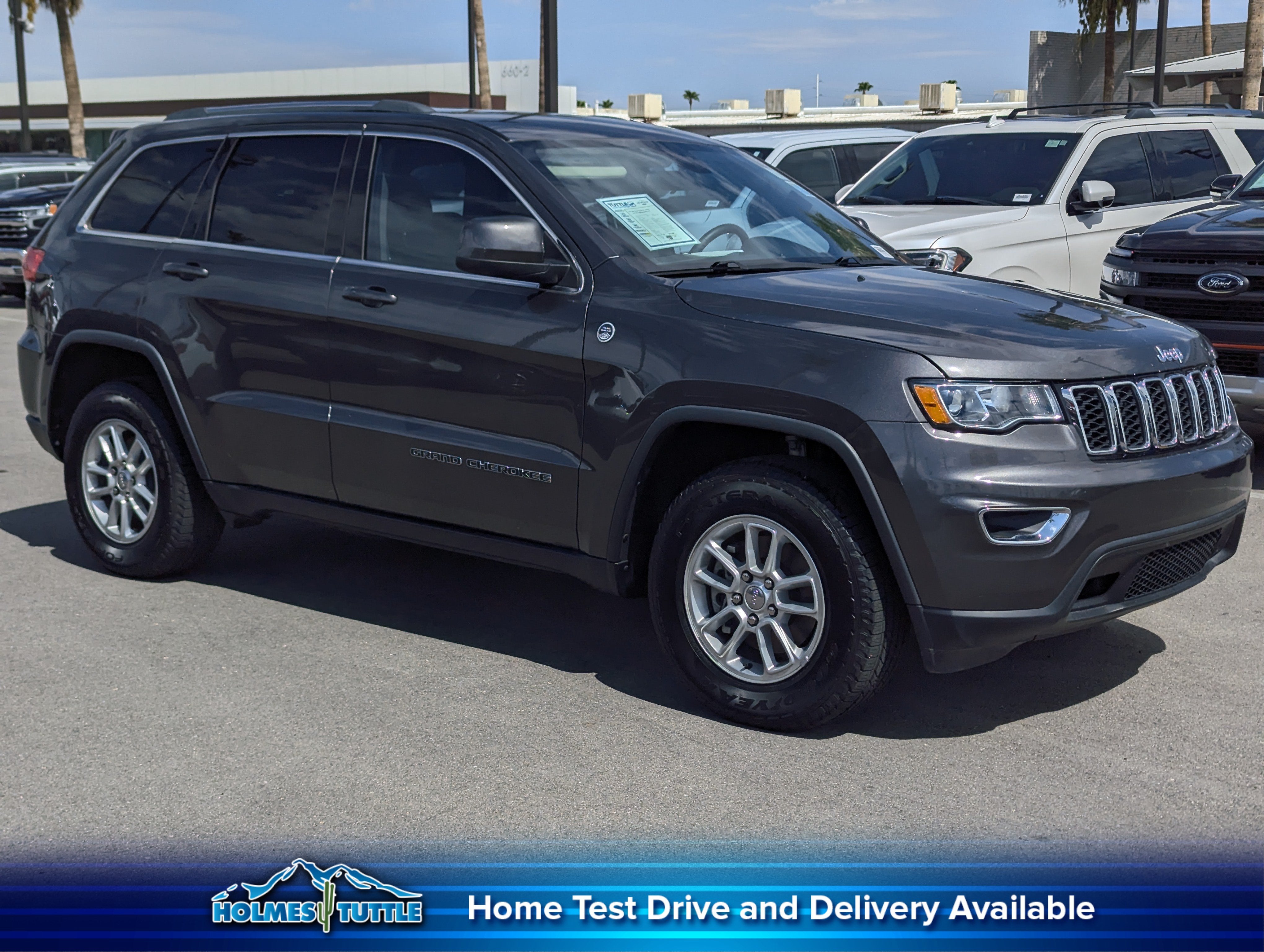 2019 Jeep Grand Cherokee Laredo E in Granite Crystal Metallic Clearcoat — front three-quarter view