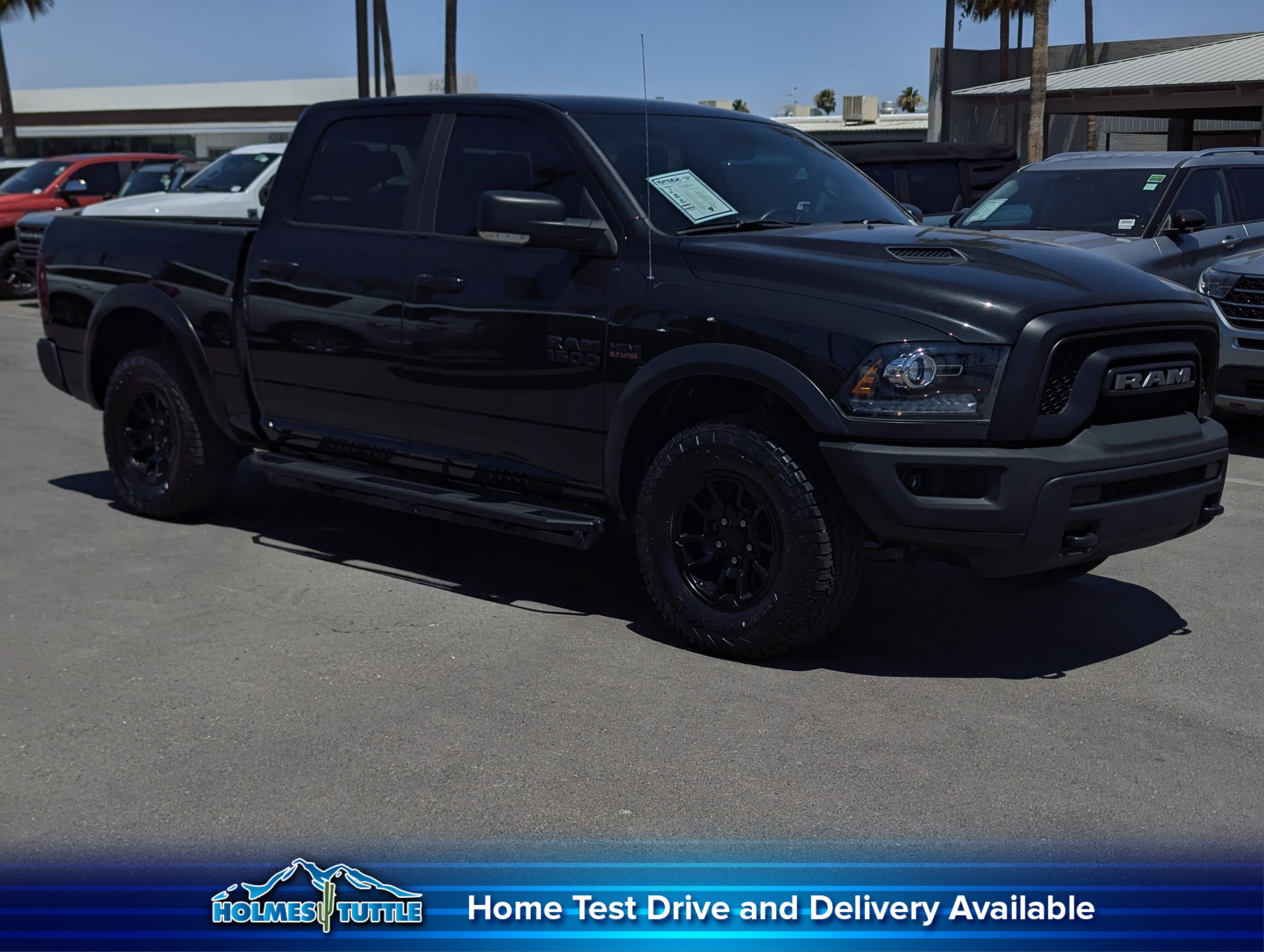 2017 RAM 1500 Rebel in Brilliant Black Crystal Pearlcoat — front three-quarter view