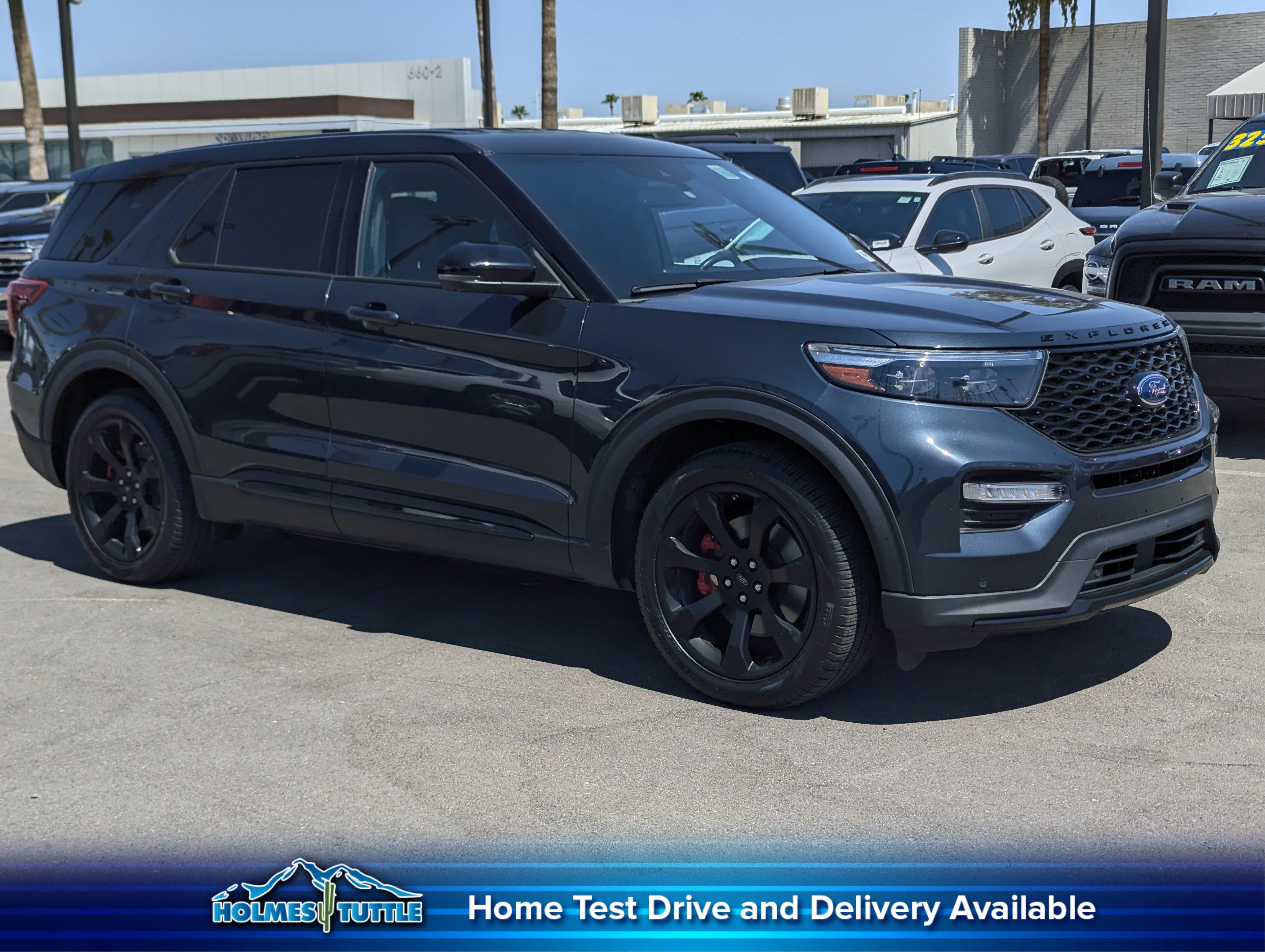 2022 Ford Explorer ST in Stone Blue Metallic — front three-quarter view
