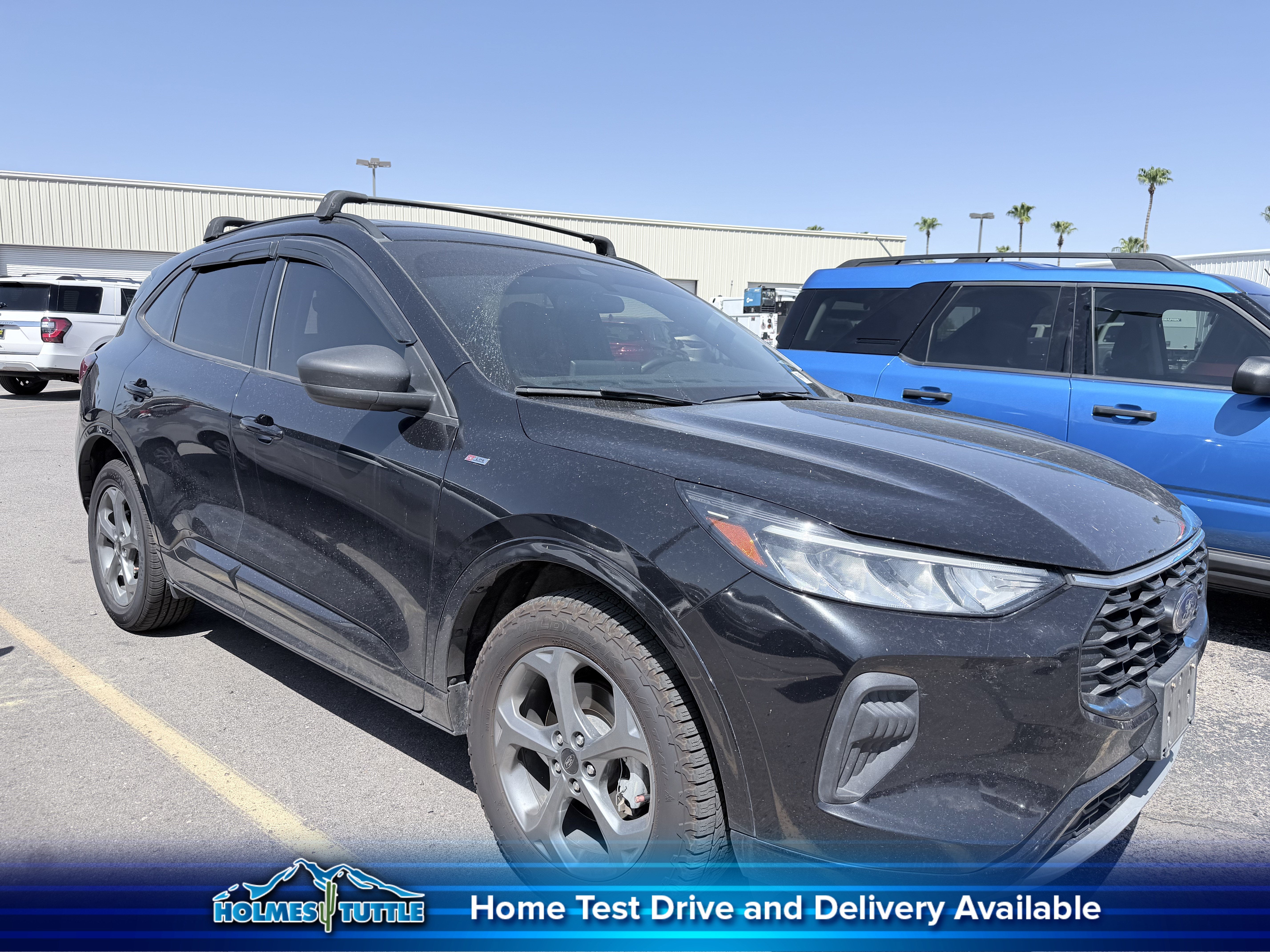 2023 Ford Escape ST-Line in Agate Black Metallic — front three-quarter view