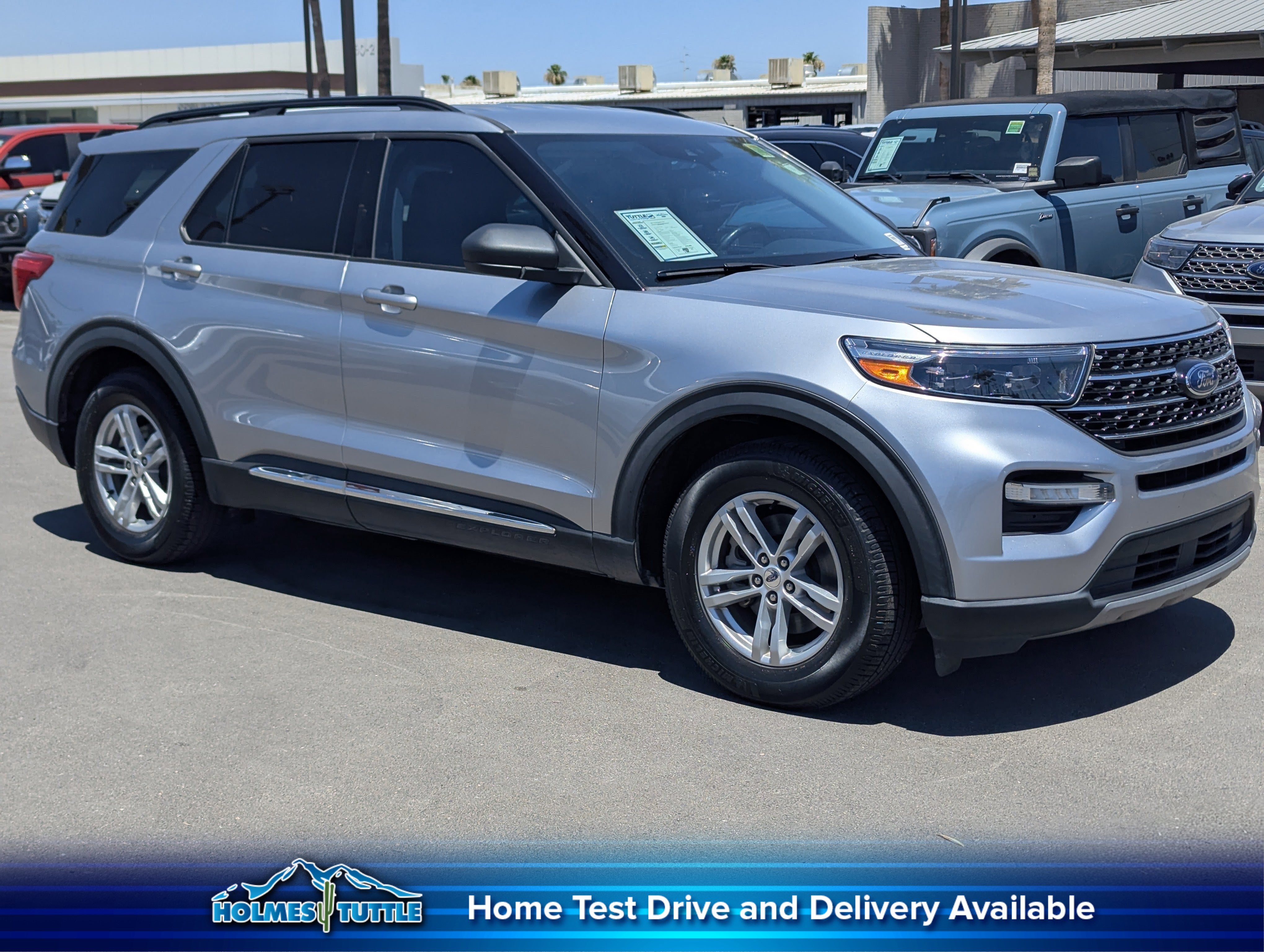 2021 Ford Explorer XLT in Iconic Silver Met — front three-quarter view