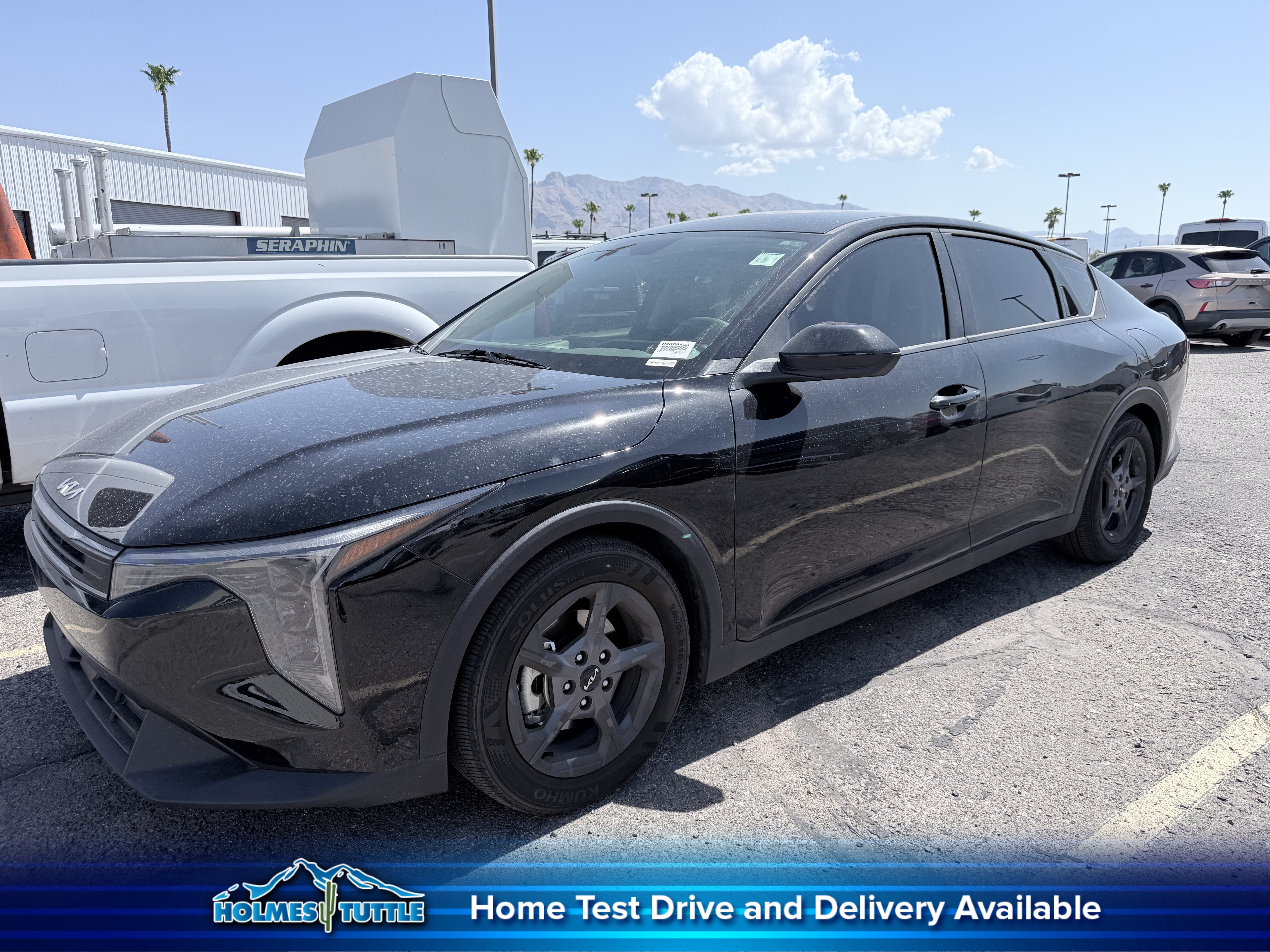 2025 Kia K4 LXS in Aurora Black Pearl — front three-quarter view