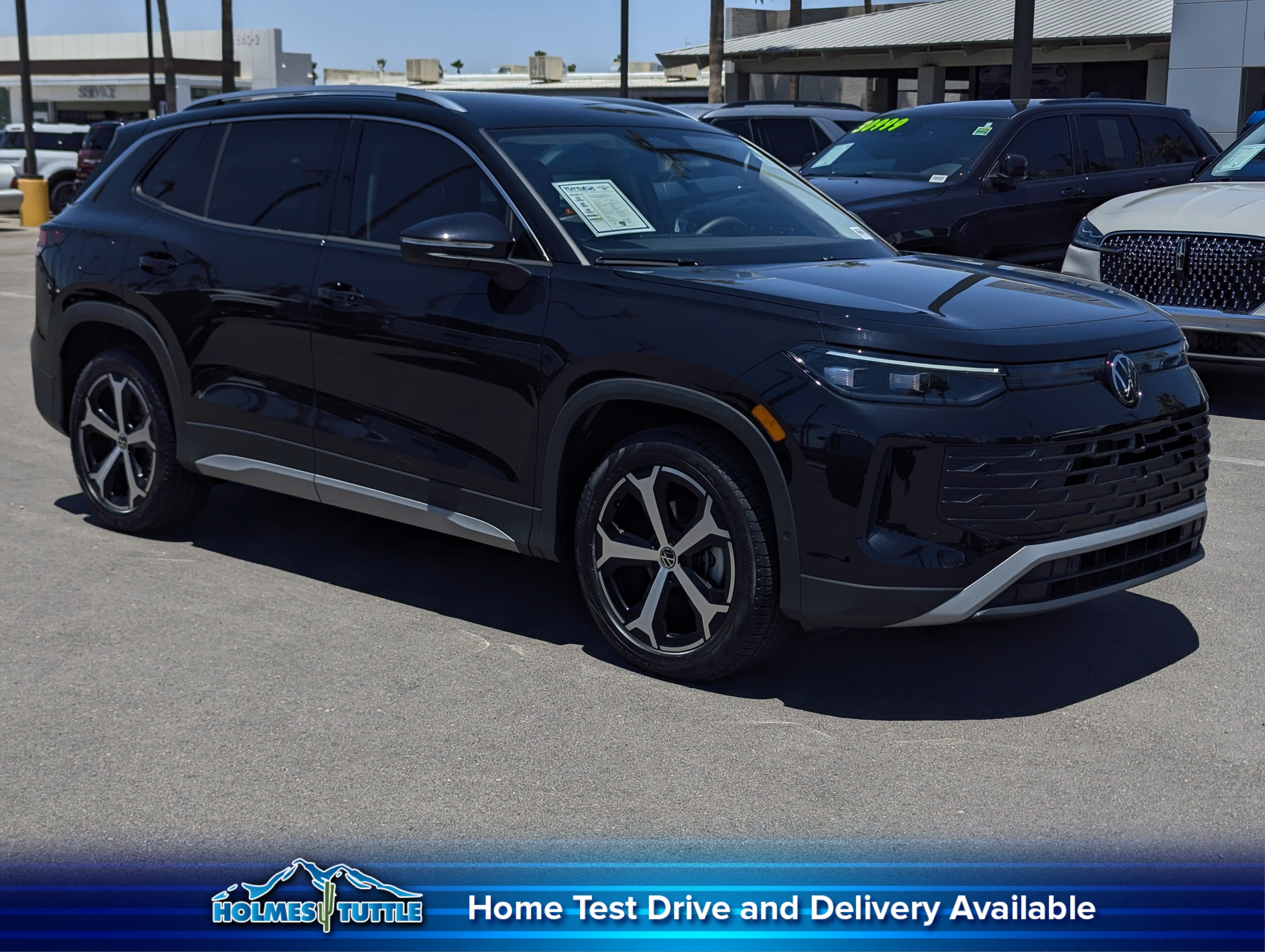 2025 Volkswagen Tiguan SE in Deep Black Pearl — front three-quarter view