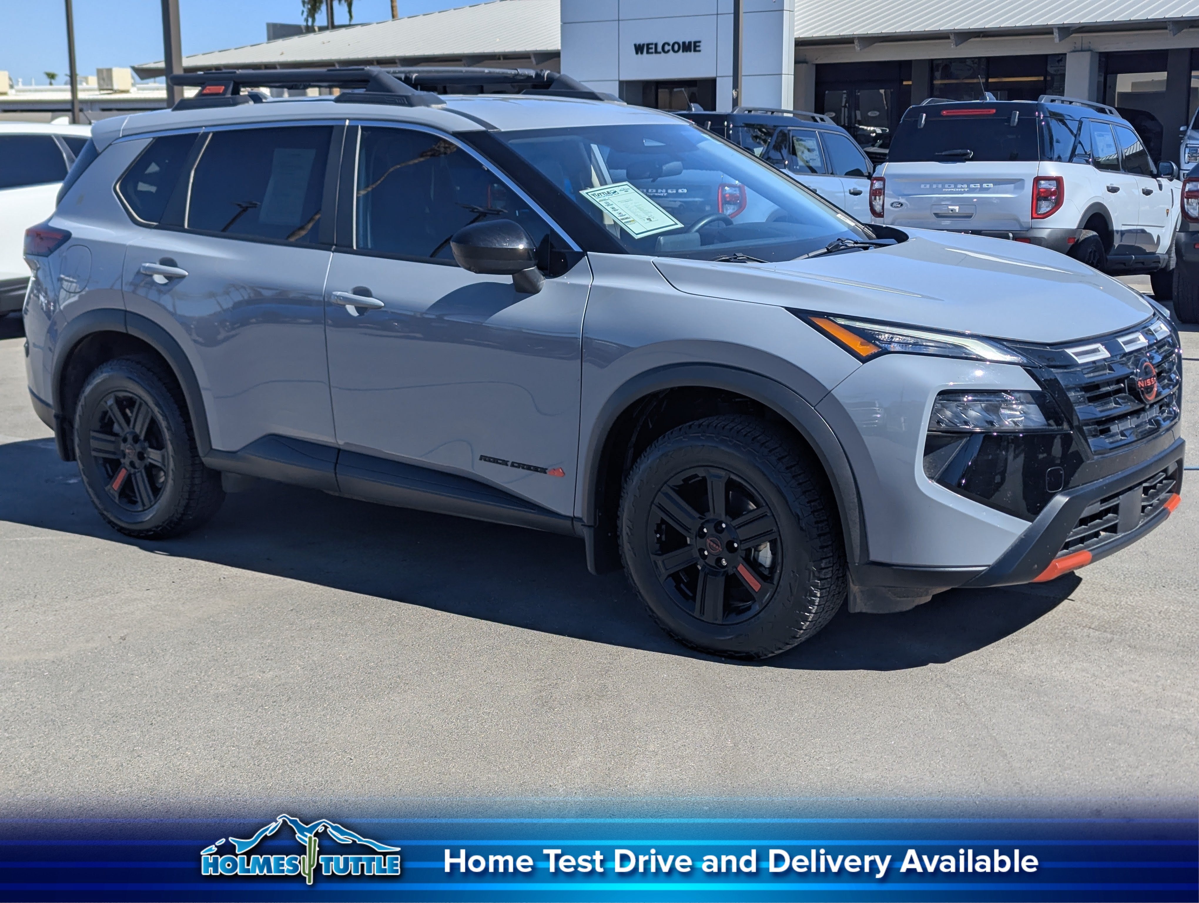 2025 Nissan Rogue Rock Creek in Boulder Gray Pearl — front three-quarter view