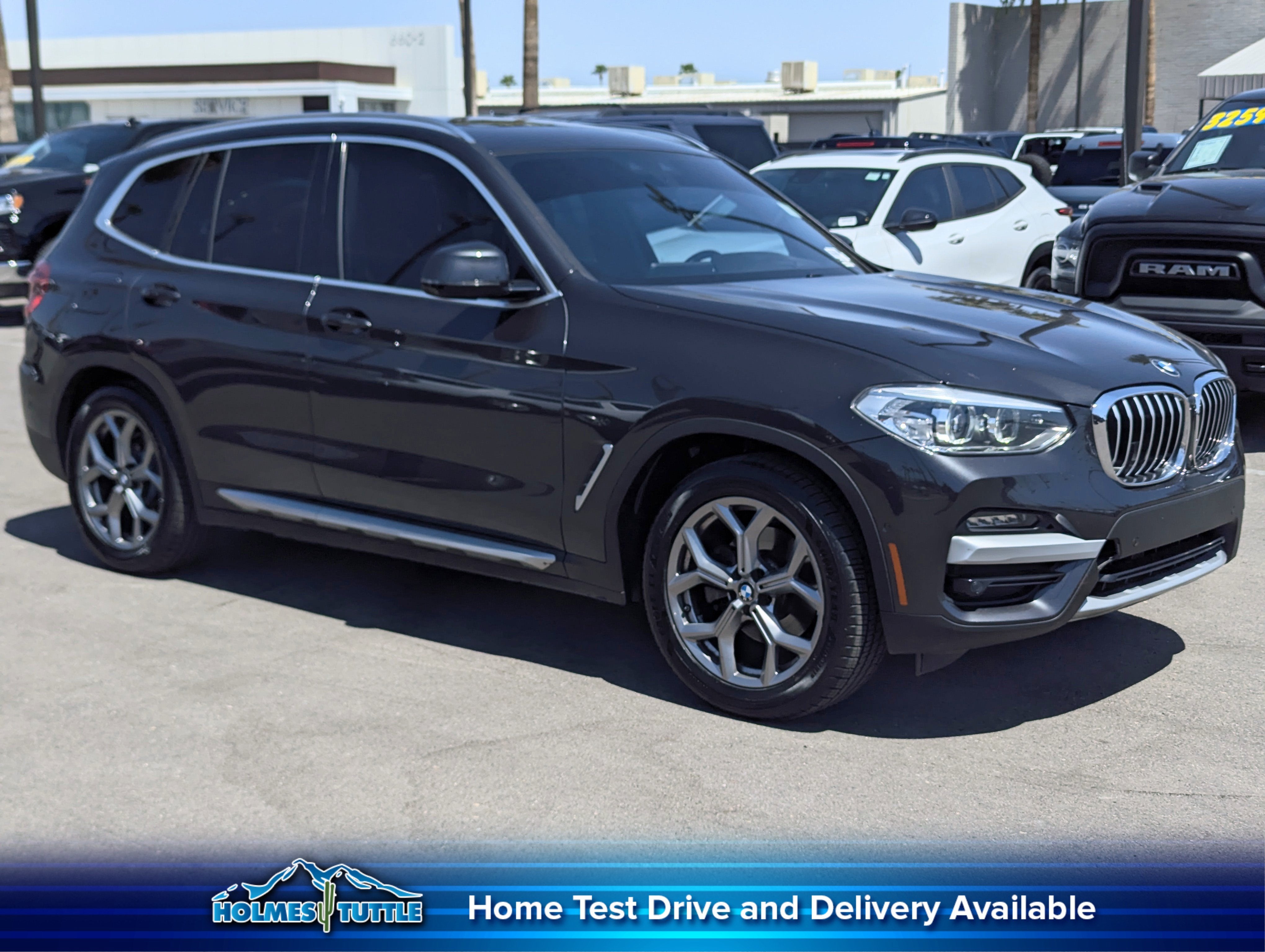 2021 BMW X3 xDrive30i in Dark Graphite Metallic — front three-quarter view